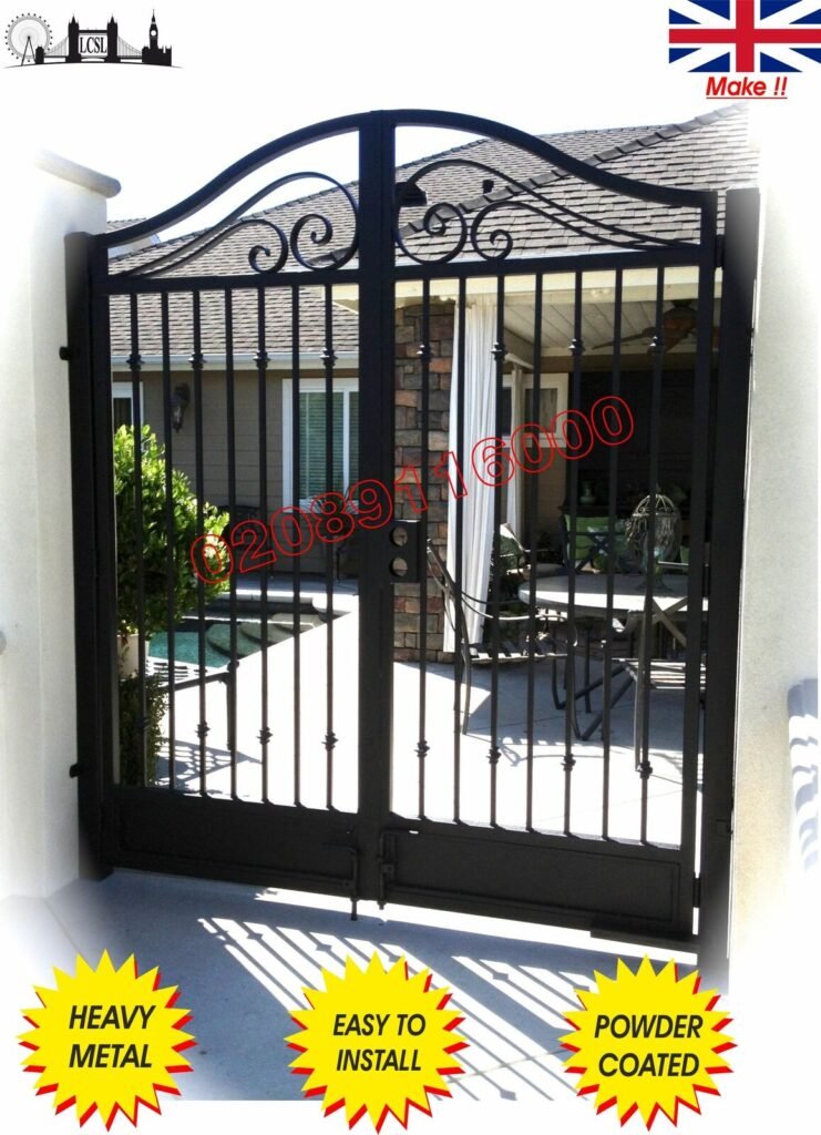 Black wrought iron garden gate with scrollwork and powder coated finish on patio entrance
