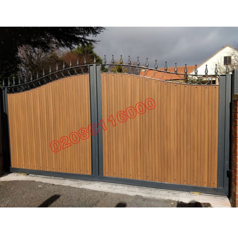Wood effect metal driveway gates with anthracite frame and scrolled swan-neck top