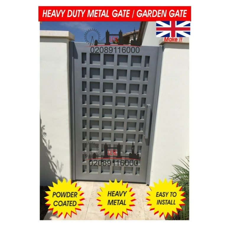 Grey metal garden gate with square grid pattern fitted between white garden walls