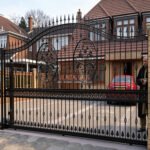 Custom Arched Metal Driveway Gates with Ornate Oval Medallions UKMDG121