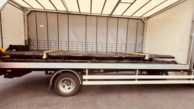 Home 9 Metal gates loaded on the bed of a delivery vehicle